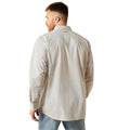 Man wearing a patterned shirt on a white background