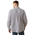 Man wearing a patterned shirt on a white background