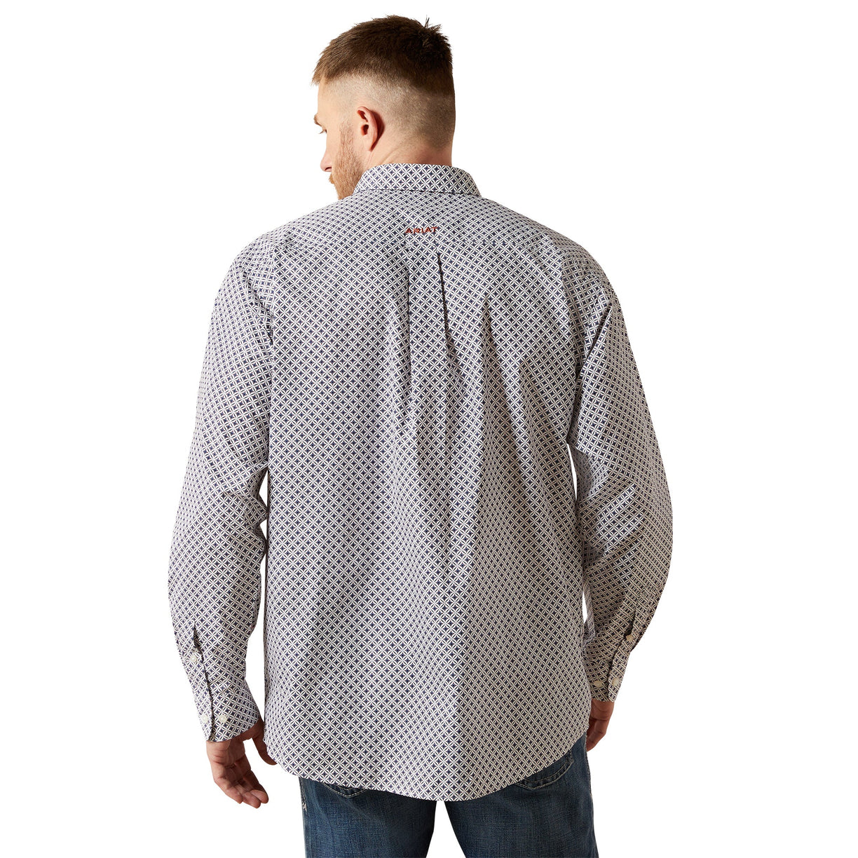 Man wearing a patterned shirt on a white background