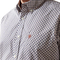Close-up of a patterned shirt with a collar and buttons.