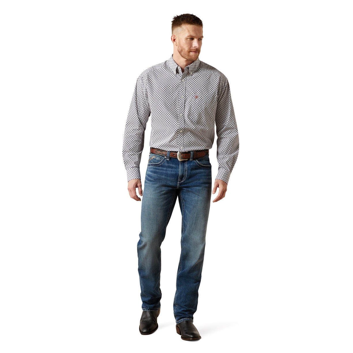 Man wearing a patterned shirt, jeans, and shoes on a white background