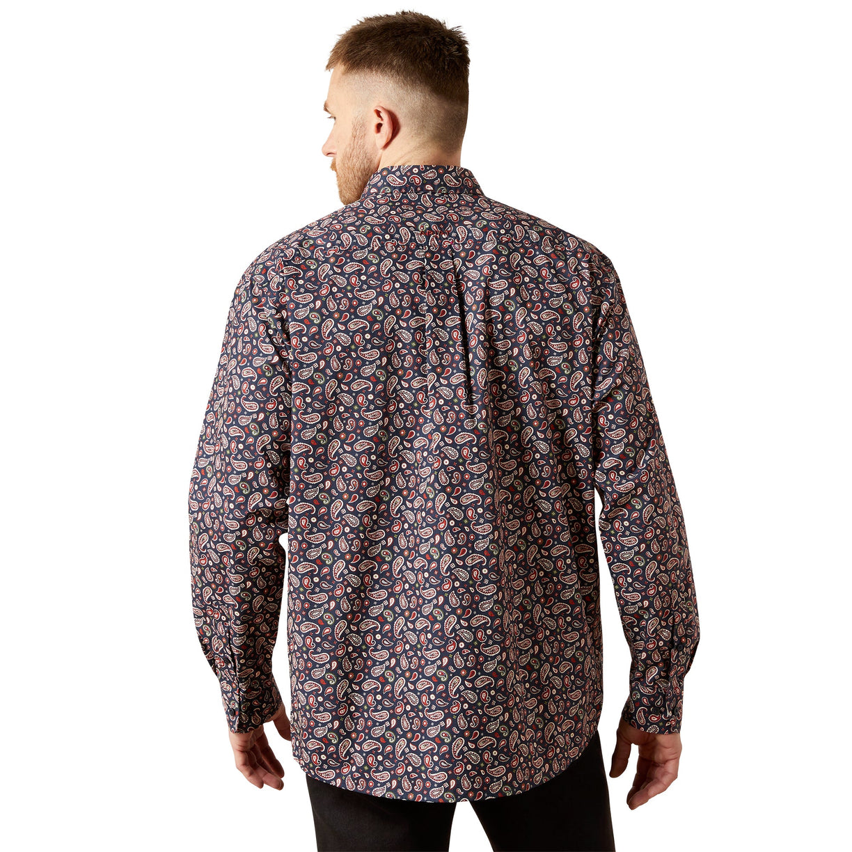 Man wearing a patterned shirt on a white background