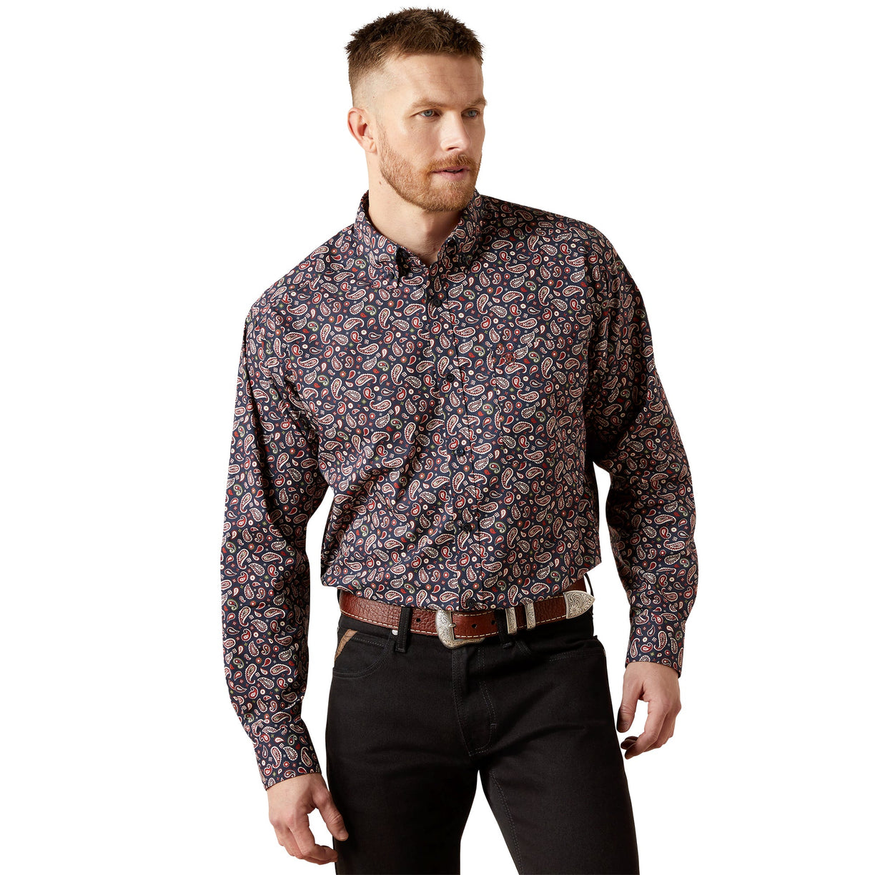 Man wearing a patterned shirt and black pants on a white background