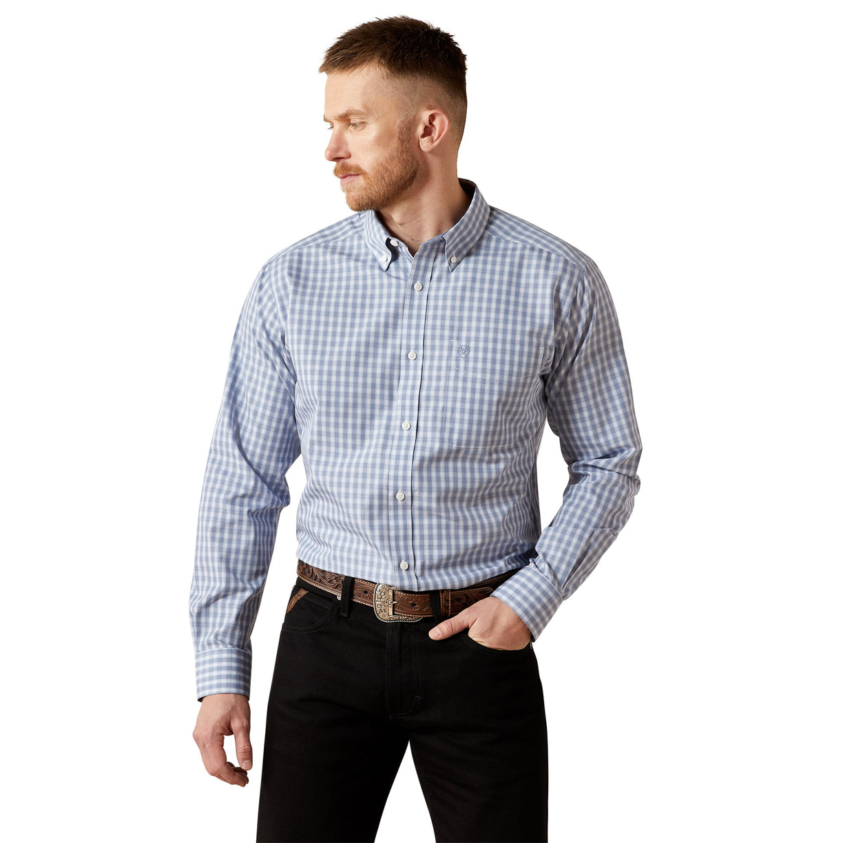 Man wearing a blue checkered shirt and black pants on a white background