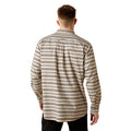 Man wearing a patterned shirt on a white background