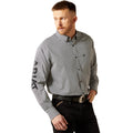 Man wearing a gray patterned shirt with 'Ariat' branding on a white background