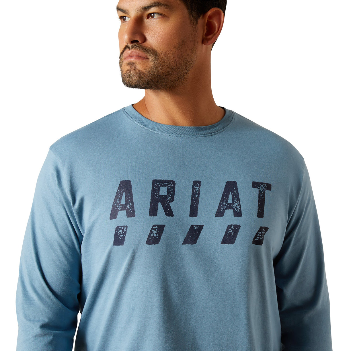 Man wearing a blue Ariat long-sleeve shirt on a white background