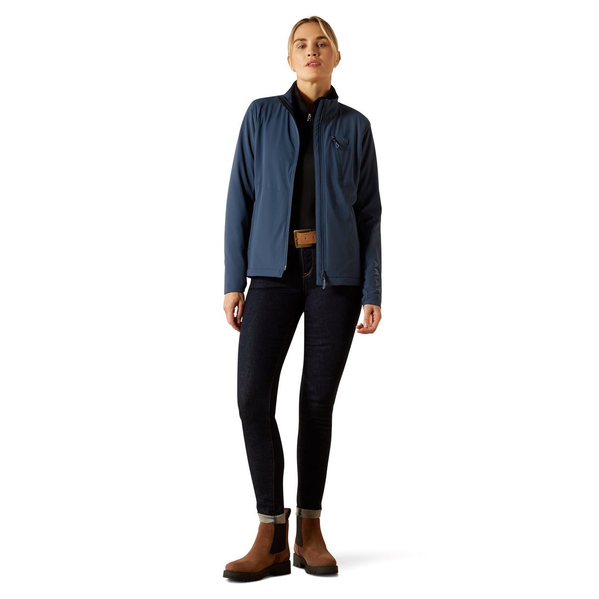 Person wearing a blue jacket, black pants, and brown boots on a white background