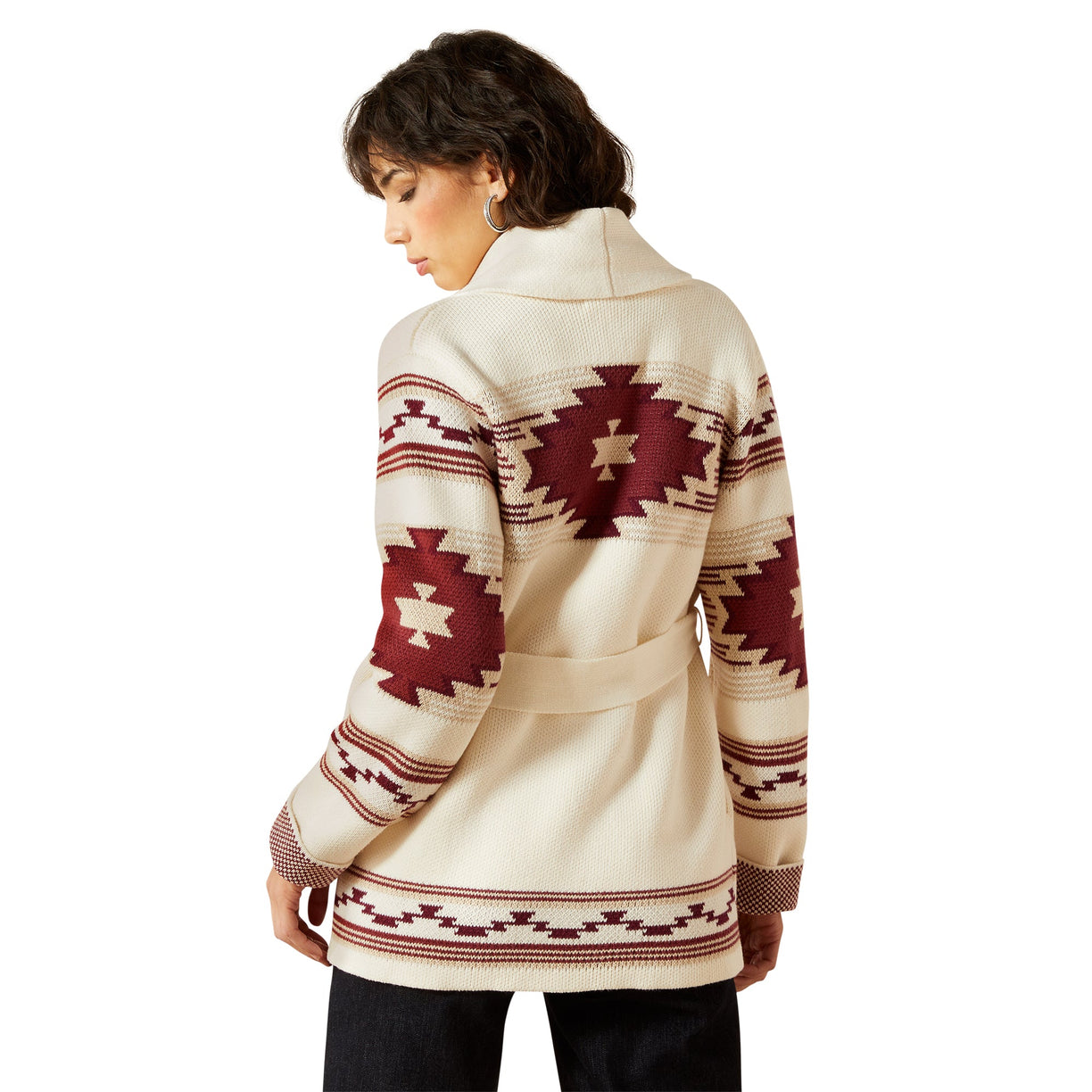 Woman wearing a patterned jacket on a white background