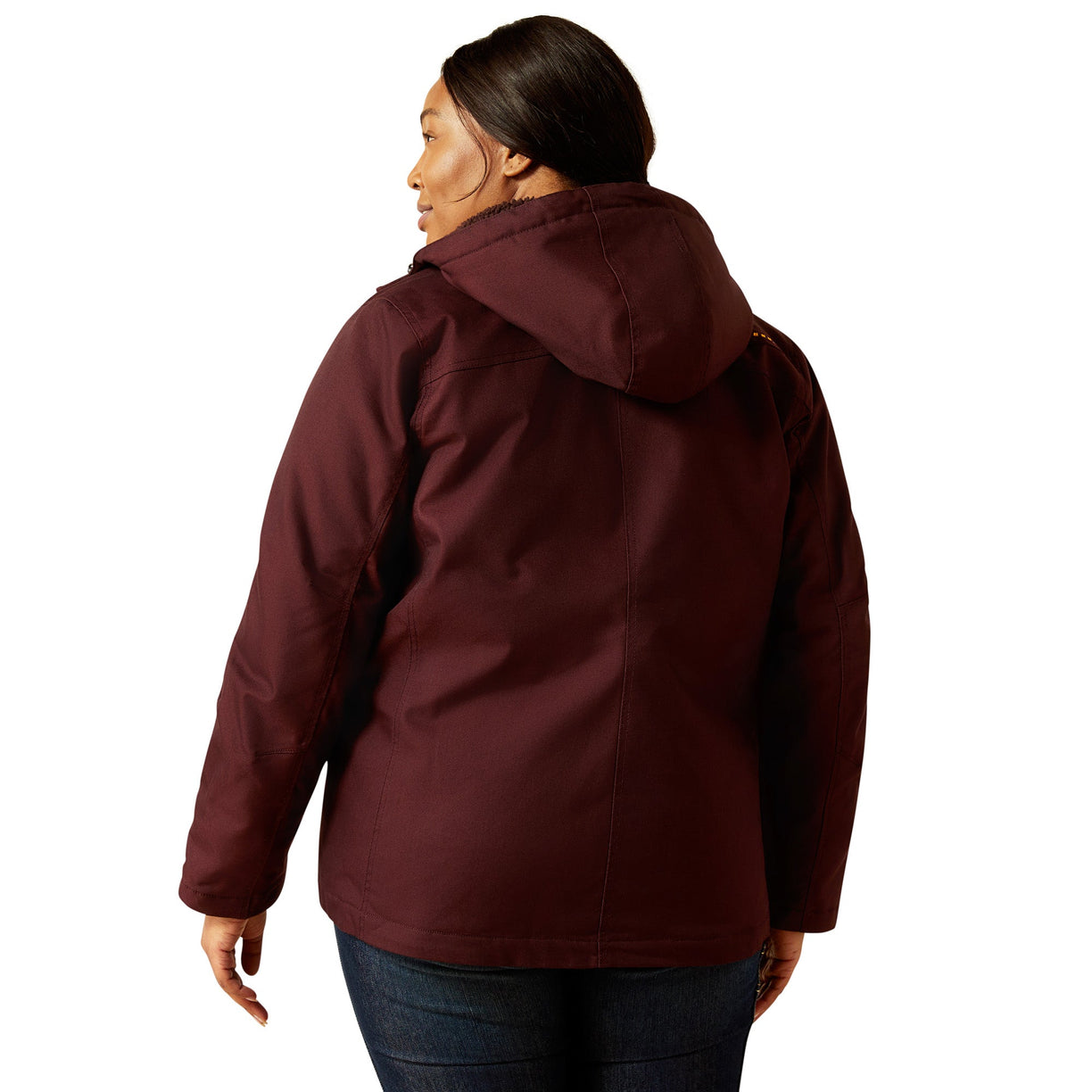 Person wearing a maroon jacket on a white background