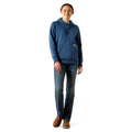Person wearing a blue hoodie and jeans on a white background