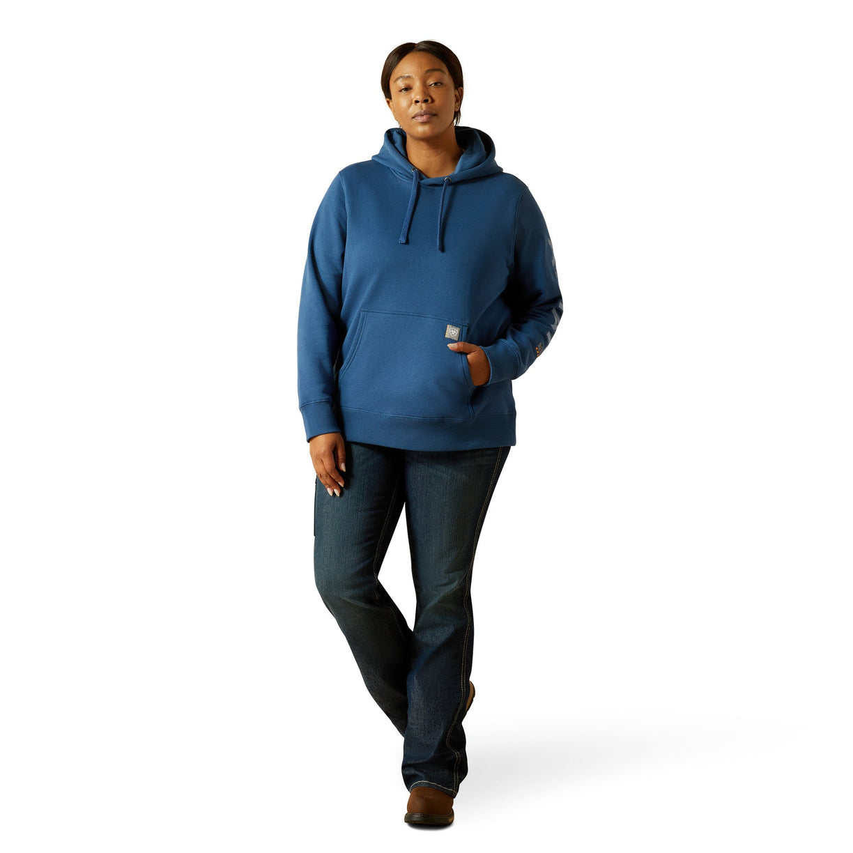 Person wearing a blue hoodie and dark pants on a white background