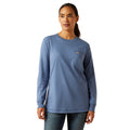 Woman wearing a blue long-sleeve shirt with a logo on a white background
