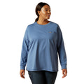 Woman wearing a blue long-sleeve shirt on a white background