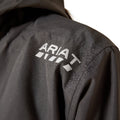 Close-up of a black jacket with 'Ariat' logo on the back