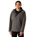 Person wearing a gray jacket on a white background