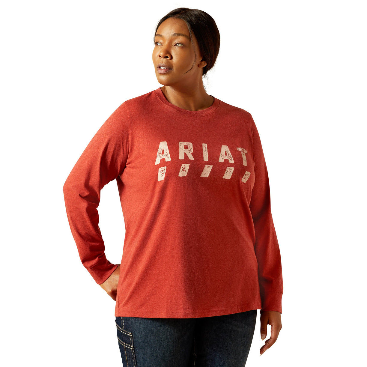 Person wearing a red Ariat long-sleeve shirt on a white background