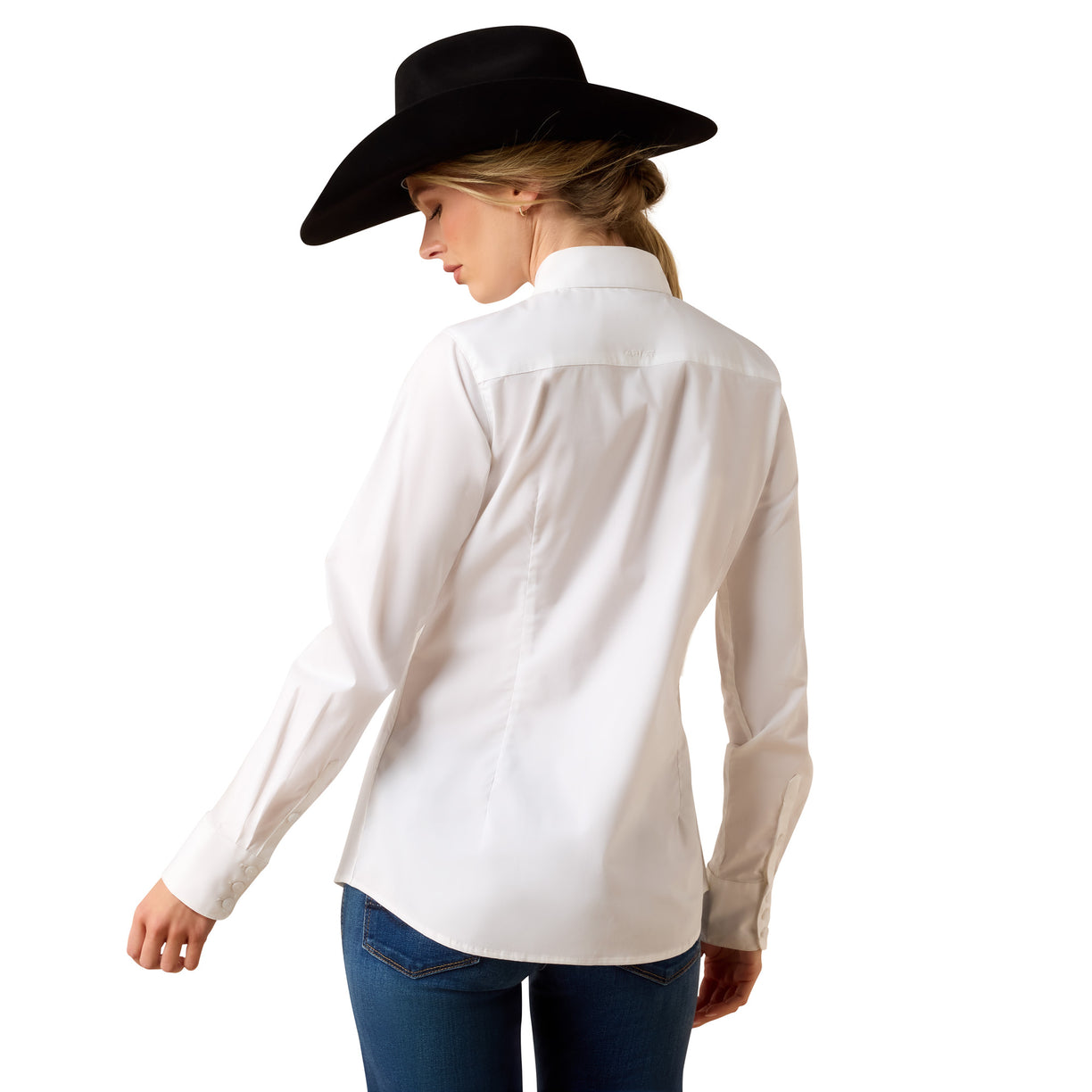 Woman wearing a white shirt and black cowboy hat on a white background
