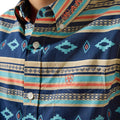 Close-up of a patterned shirt with visible brand logo