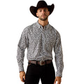 Man wearing a patterned shirt and cowboy hat on a white background