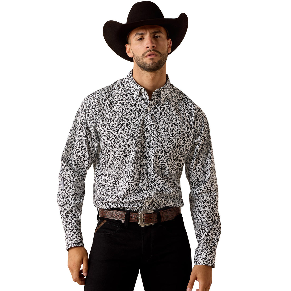 Man wearing a patterned shirt and cowboy hat on a white background