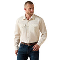 Man wearing a beige button-up shirt and blue jeans on a white background