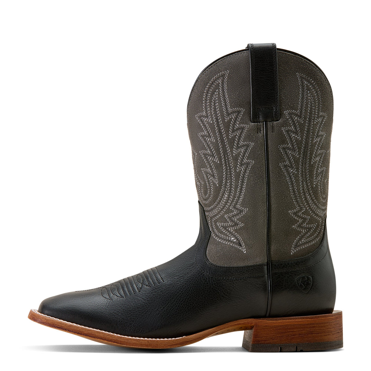 Black cowboy boot with brown sole on a white background