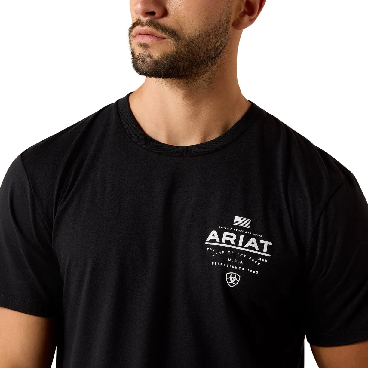 Person wearing a black t-shirt with Ariat logo