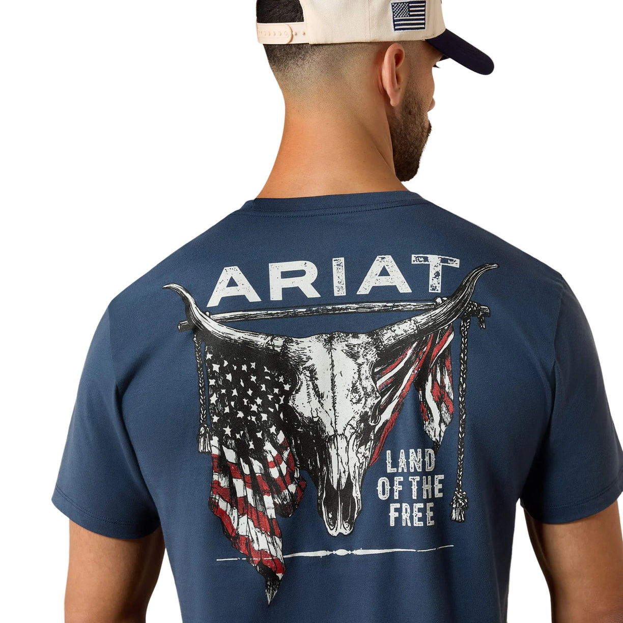 Man wearing a blue Ariat t-shirt with a graphic design on the back.