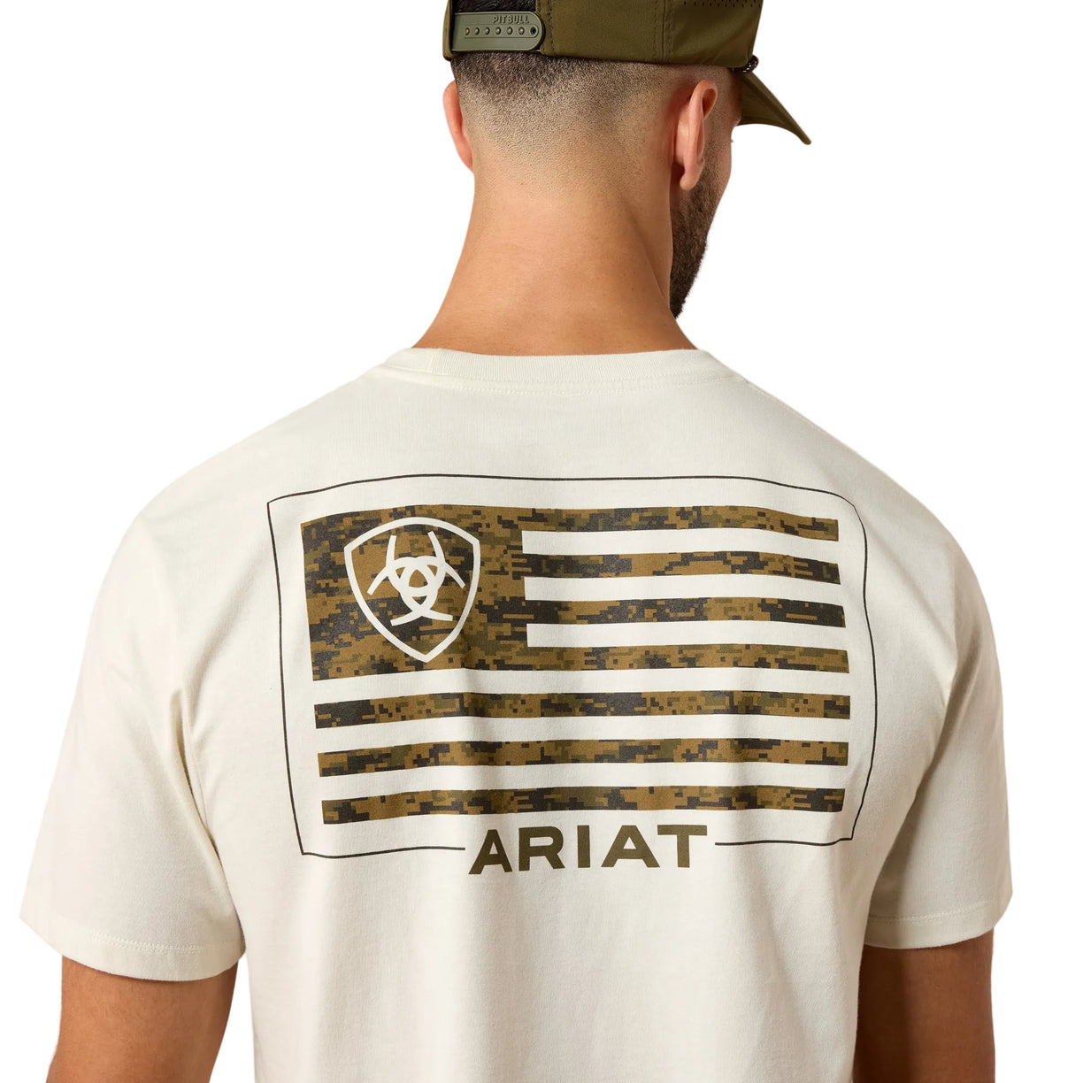 Person wearing a white t-shirt with a camouflage flag design and 'Ariat' branding on the back.