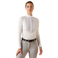 The SolVeil Show Shirt in white with a pleated bib front and mock neck, styled with light grey riding pants.