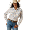 Woman wearing a patterned shirt, jeans, and a cowboy hat on a white background