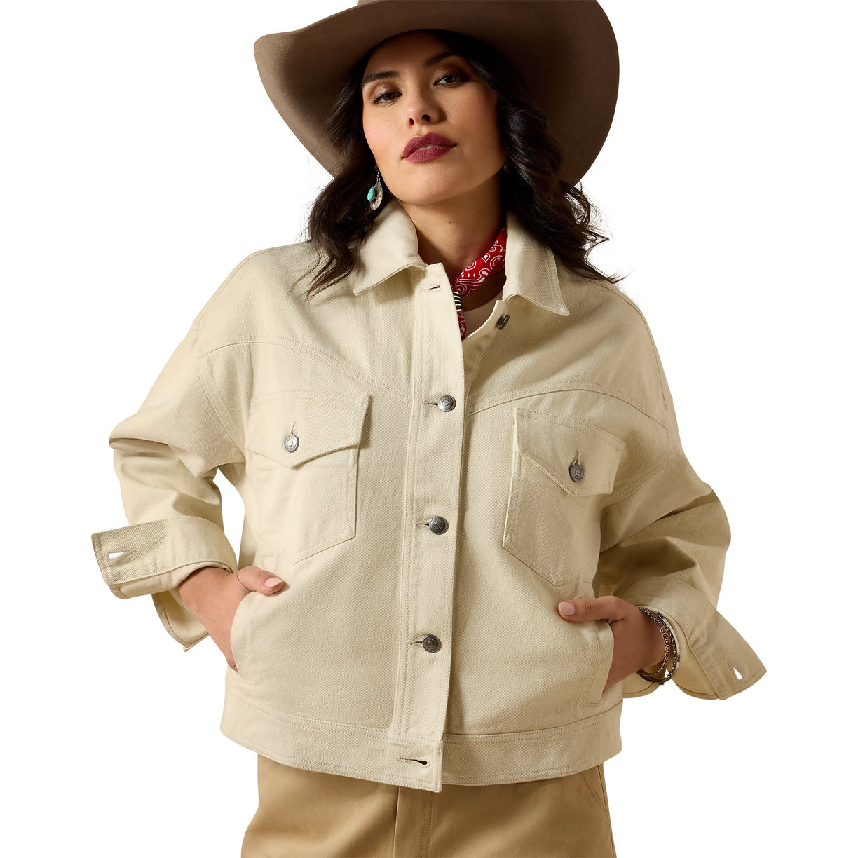 Woman wearing a beige jacket and hat on a white background