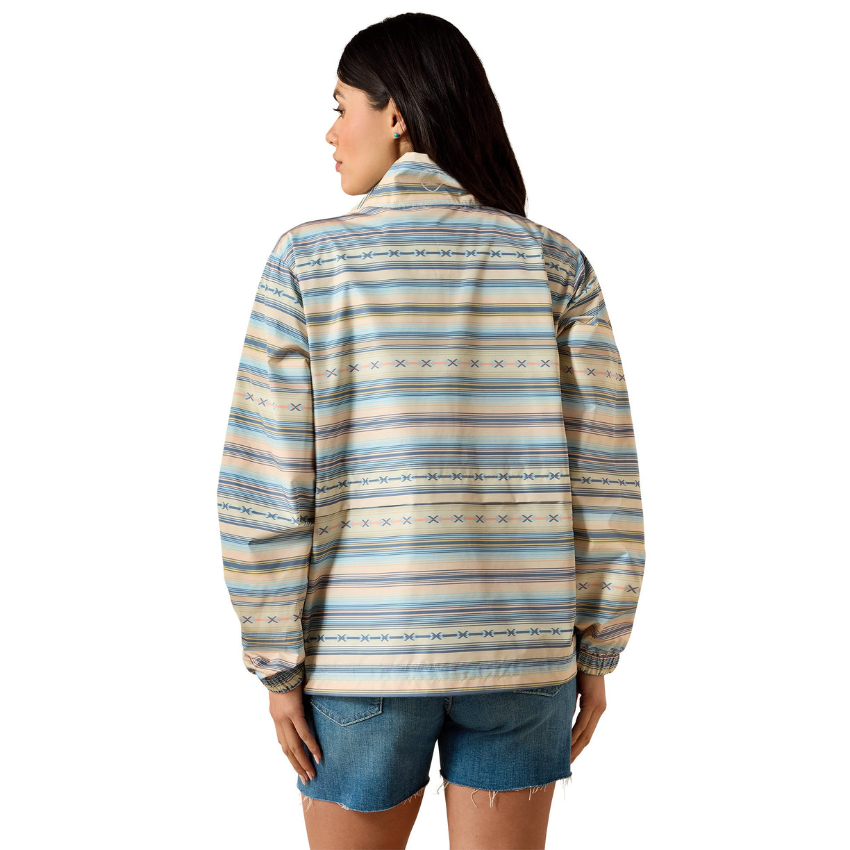 Woman wearing a patterned shirt with a white background