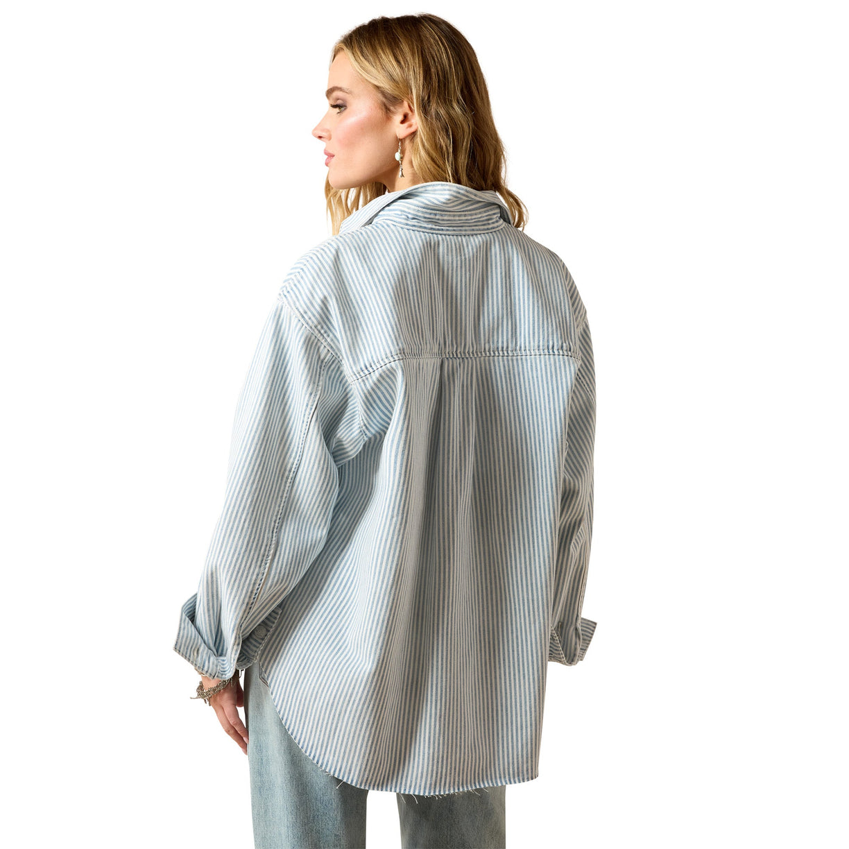 Woman wearing a light blue and white striped shirt on a white background