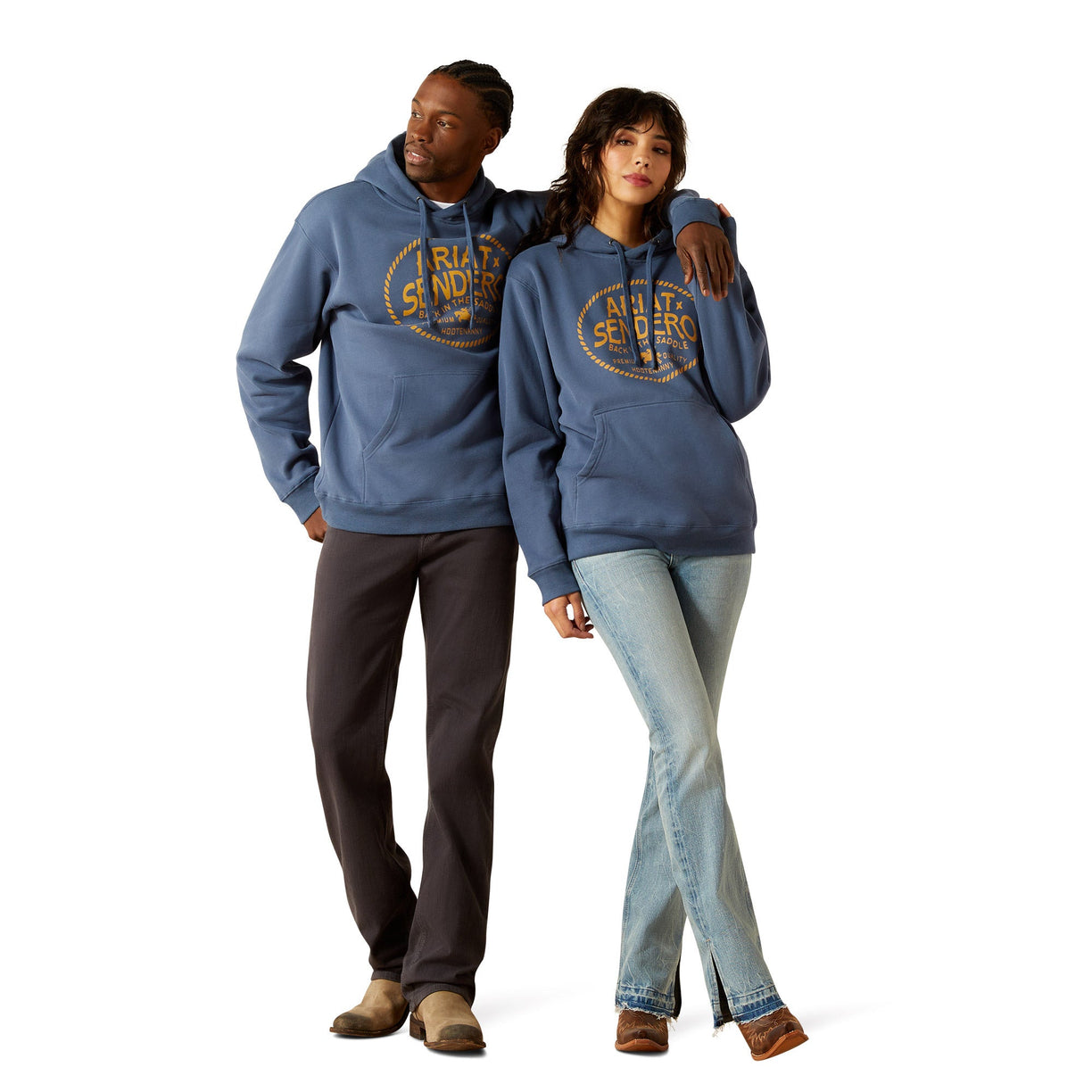 Two people wearing matching blue hoodies with a logo on a white background