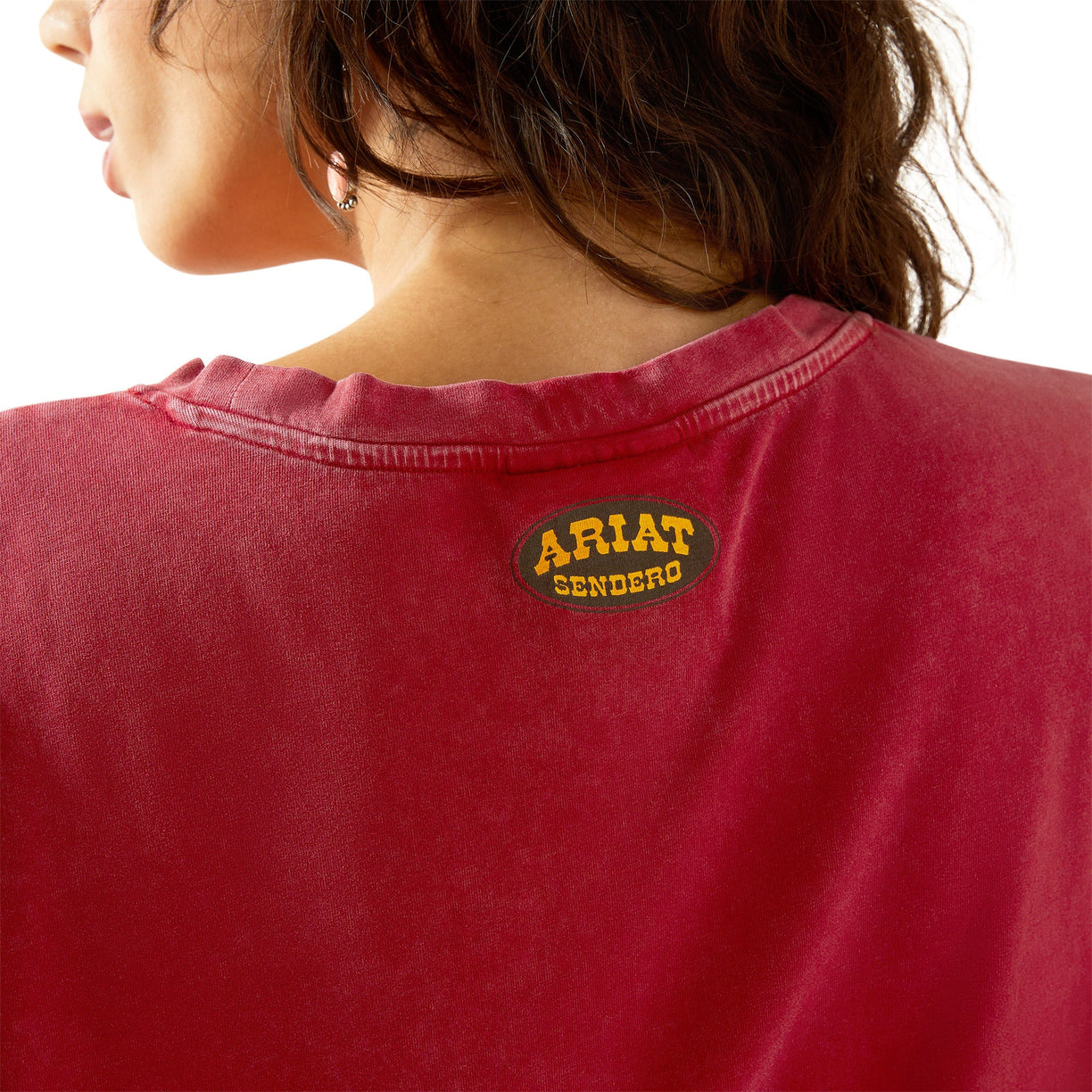 Red shirt with Ariat Sendero logo on a white background
