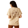 Person wearing a beige t-shirt with a graphic and text on the back, on a white background