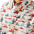 Close-up of a shirt with a colorful desert pattern on a white background
