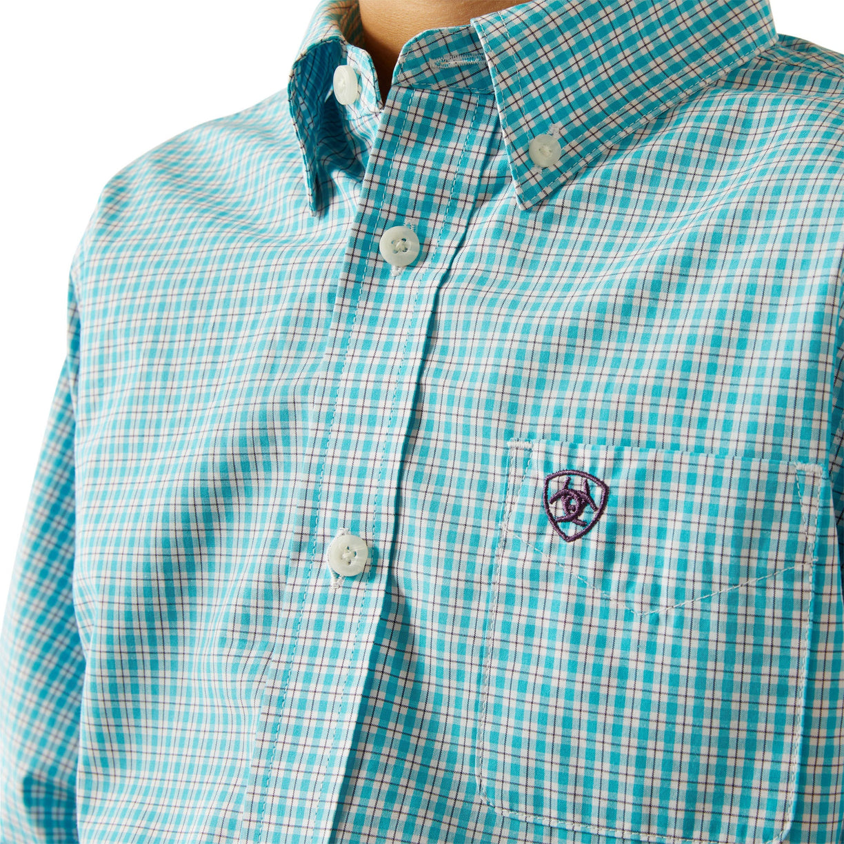 Close-up of a turquoise and white checkered shirt with a brand logo on a white background