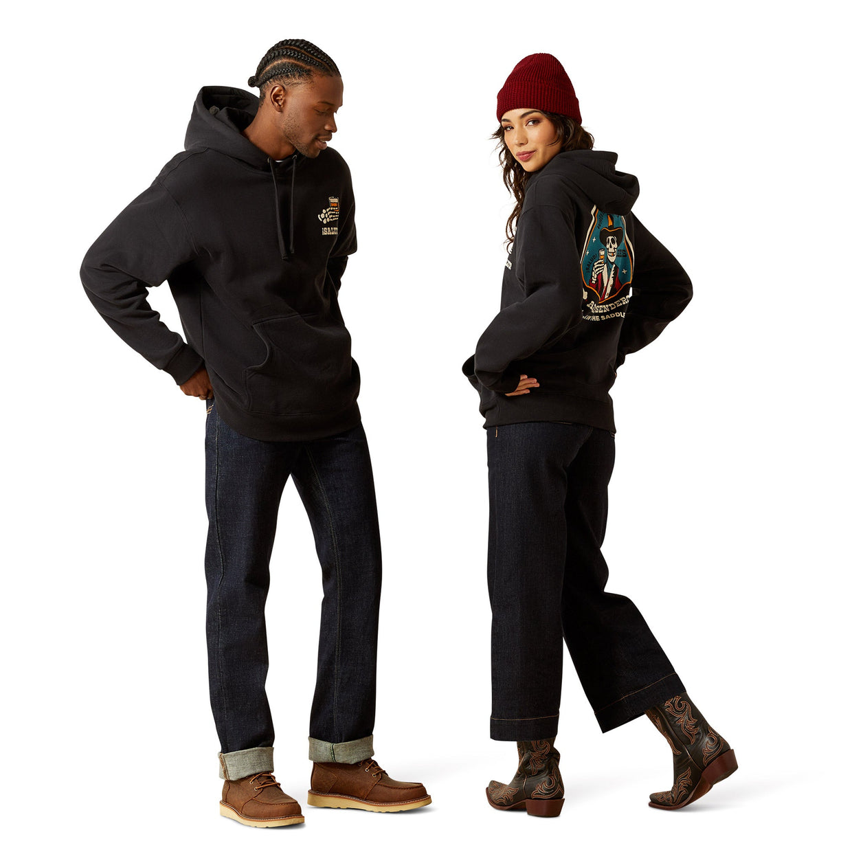 Two people wearing black hoodies with visible branding on a white background