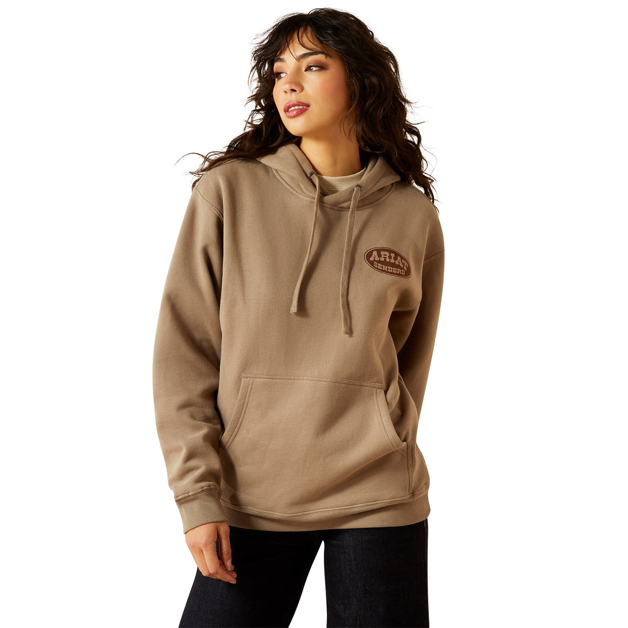Woman wearing a beige hoodie with a logo on a white background