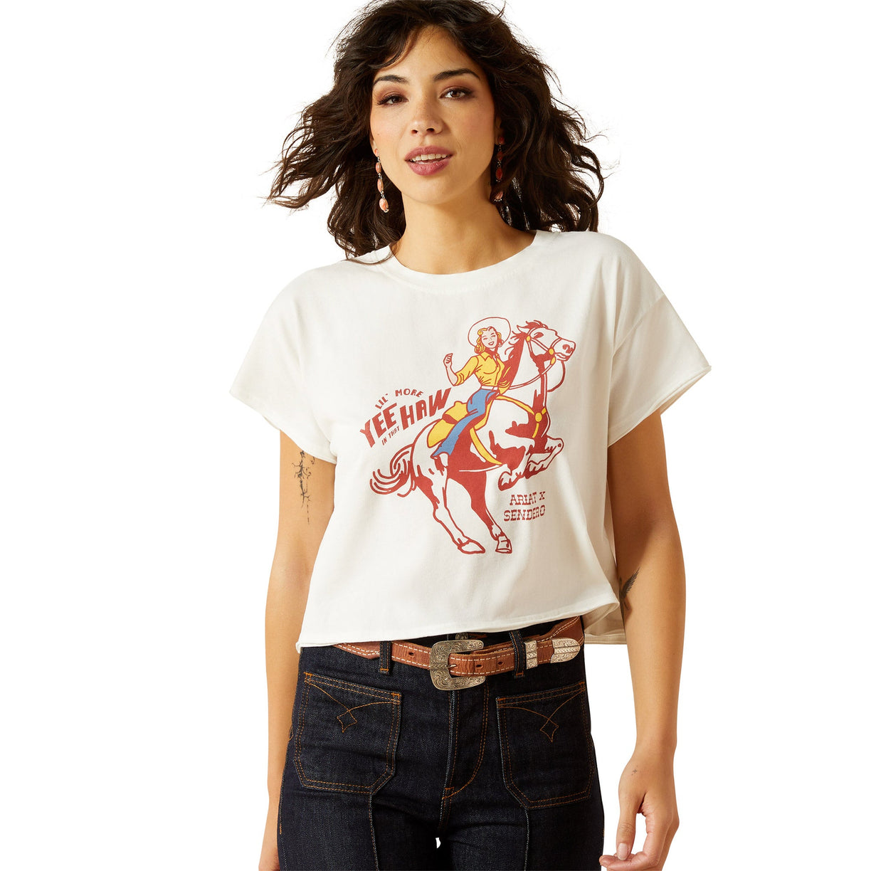 Woman wearing a white t-shirt with a graphic design on a white background
