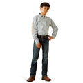 Person wearing a patterned shirt, jeans, and brown shoes on a white background