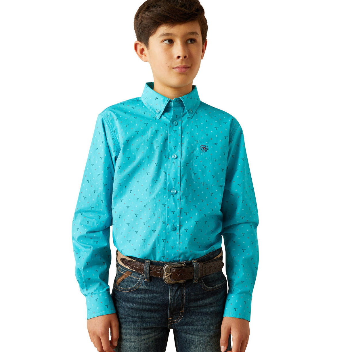 Young boy wearing a turquoise patterned shirt and jeans on a white background