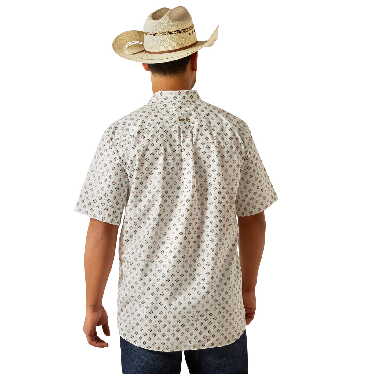 Man wearing a patterned shirt and cowboy hat on a white background
