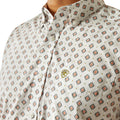 Close-up of a patterned shirt with a visible brand logo.
