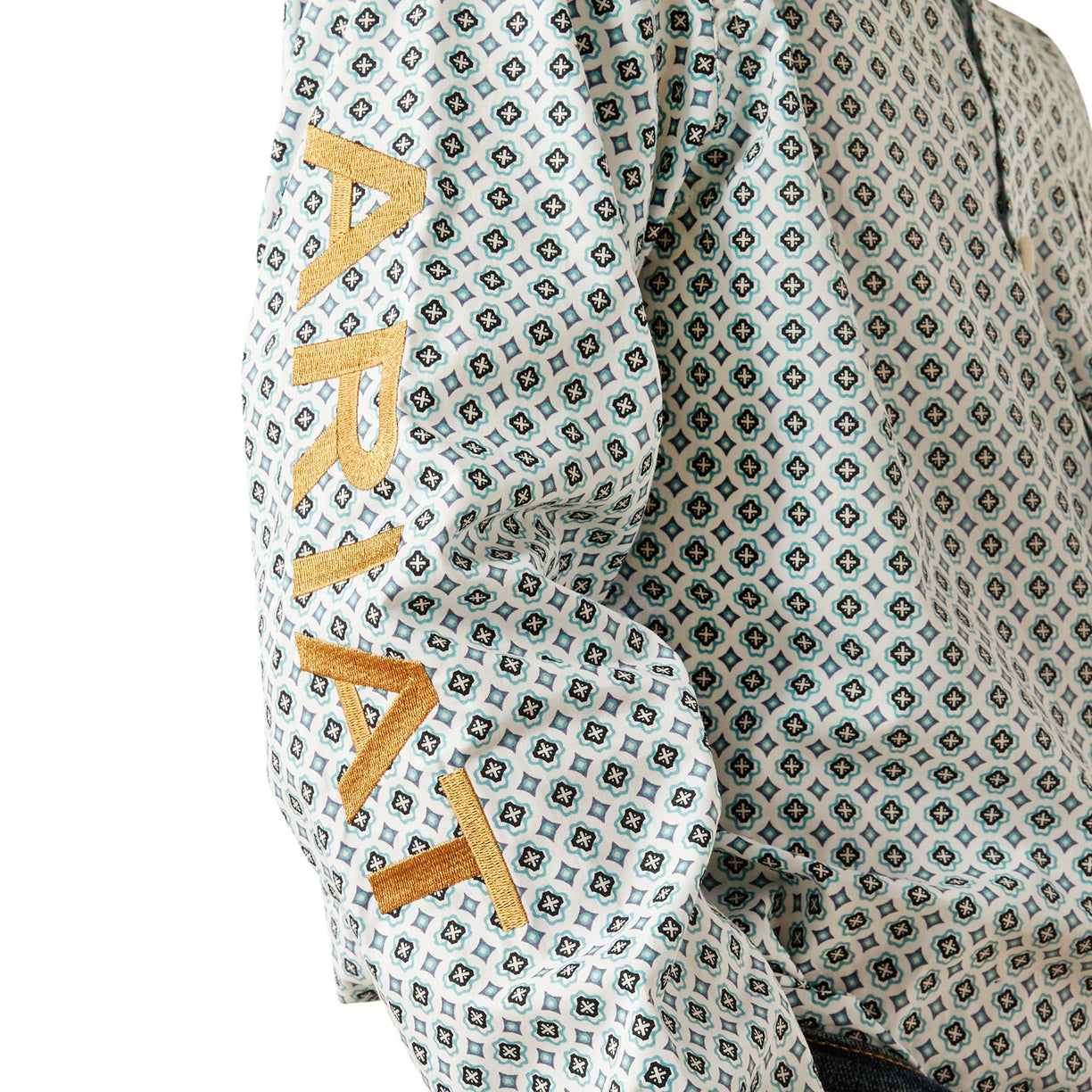 Patterned fabric with 'ARIAT' text in gold on a white background