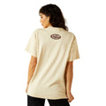 Woman wearing a beige t-shirt with a logo on the back against a white background