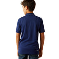 Child wearing a blue polo shirt on a white background